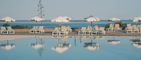 Seasonal outdoor pool, pool umbrellas, pool loungers