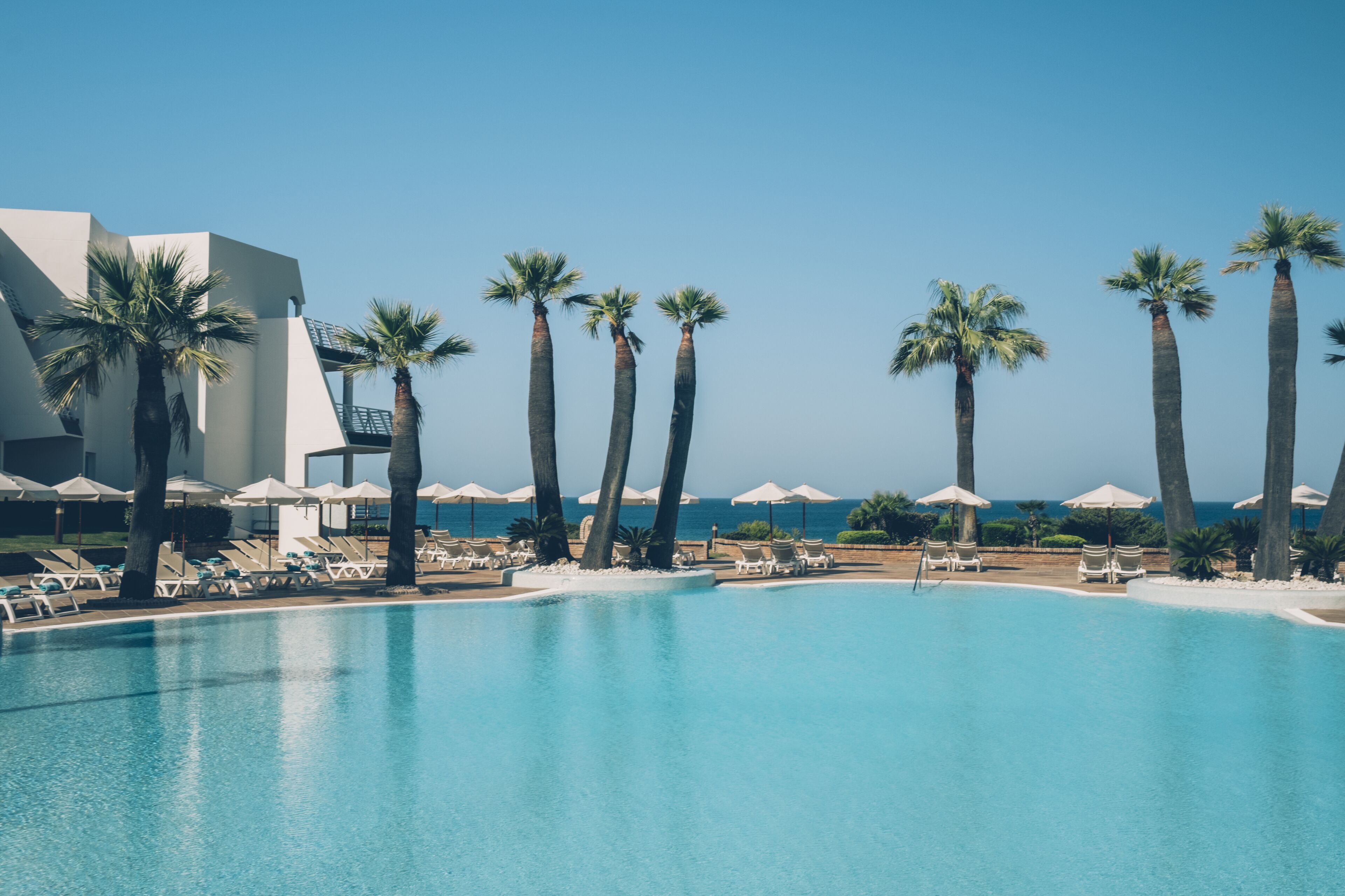 seasonal outdoor pool, pool umbrellas, pool loungers