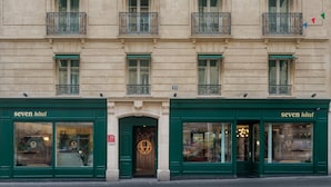 A building with multiple windows and balconies, featuring the 'Seven Hotel' signage on the ground floor. - Seven Hotel Paris (Paris)