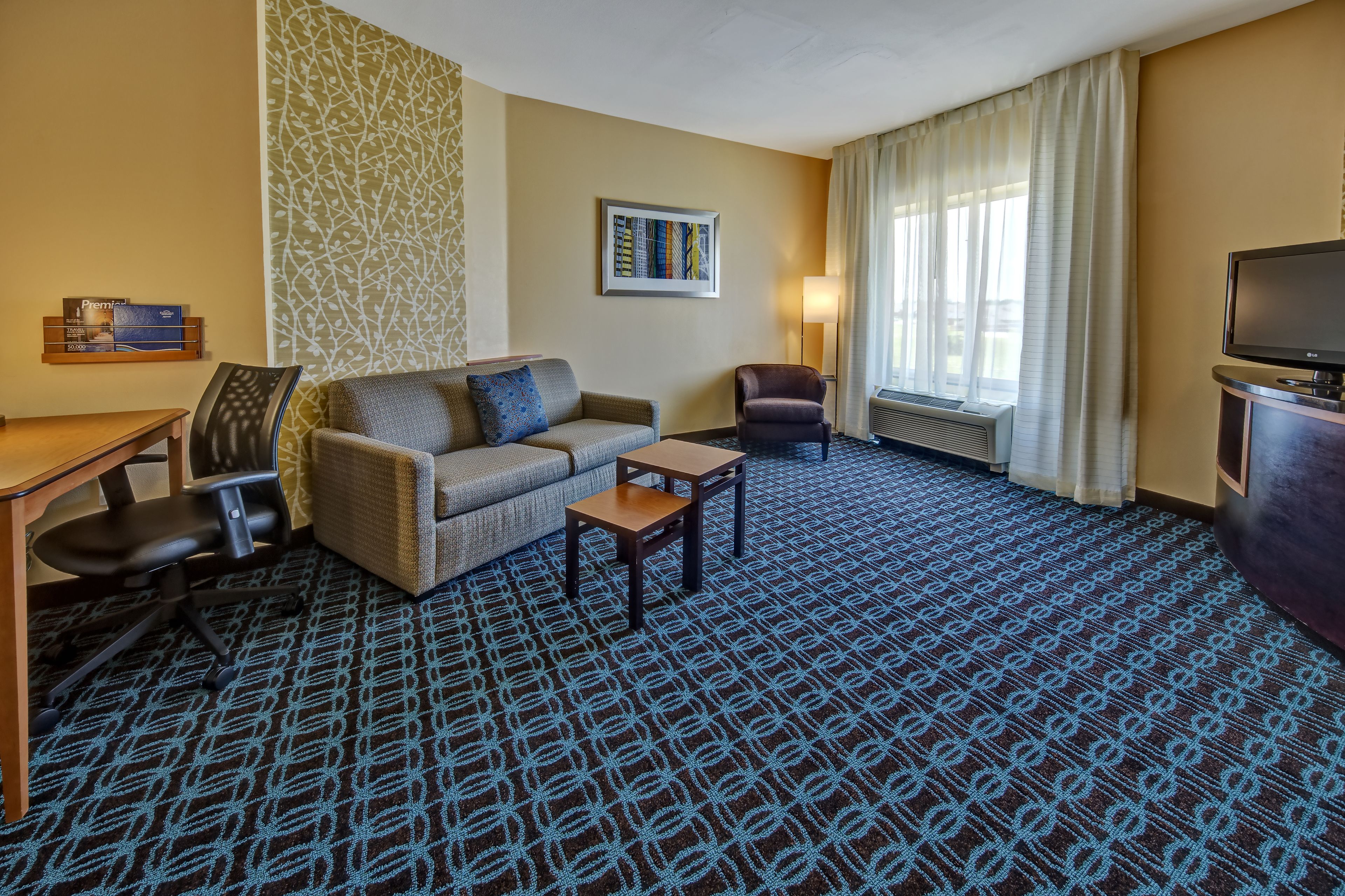 studio, 1 king bed with sofa bed, non smoking | living area | 49-inch lcd tv with satellite channels, tv