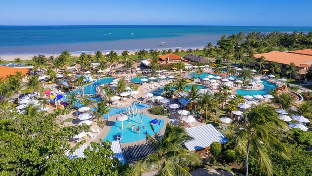 A resort with multiple swimming pools, palm trees, and a beach view. - Salinas Maragogi All Inclusive Resort (Maragogi)