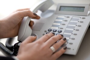 Guests can access the public telephone system with a numeric keypad and display screen.
