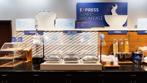 A breakfast buffet area with labeled sections for bakery, hot food, cereal, and other items. - Holiday Inn Express & Suites Guthrie North Edmond by IHG (Guthrie)