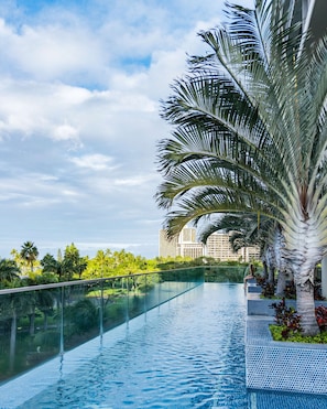 Outdoor pool, open 6:00 AM to 10:00 PM, pool loungers