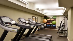 A fitness center with treadmills, exercise balls, and weight machines. - Ka Laʻi Waikiki Beach, LXR Hotels & Resorts (Honolulu)