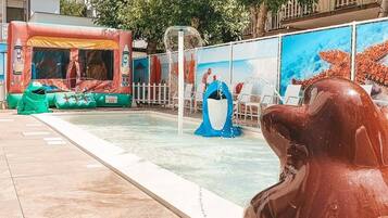 Seasonal outdoor pool, open 9 AM to 7 PM, pool umbrellas, pool loungers