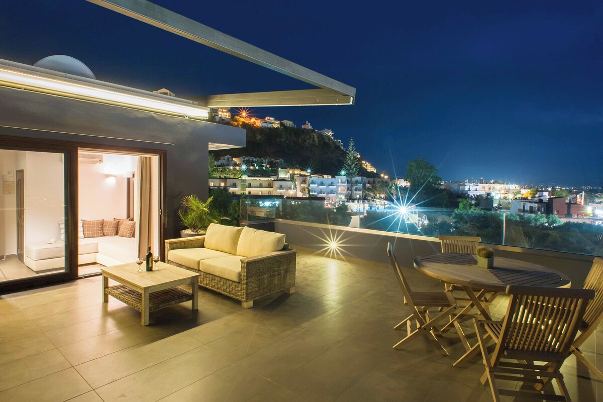 A modern outdoor living area with a sofa, coffee table, and dining set.