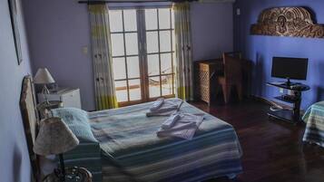 Superior Quadruple Room, Sea View | Minibar, in-room safe, desk, iron/ironing board