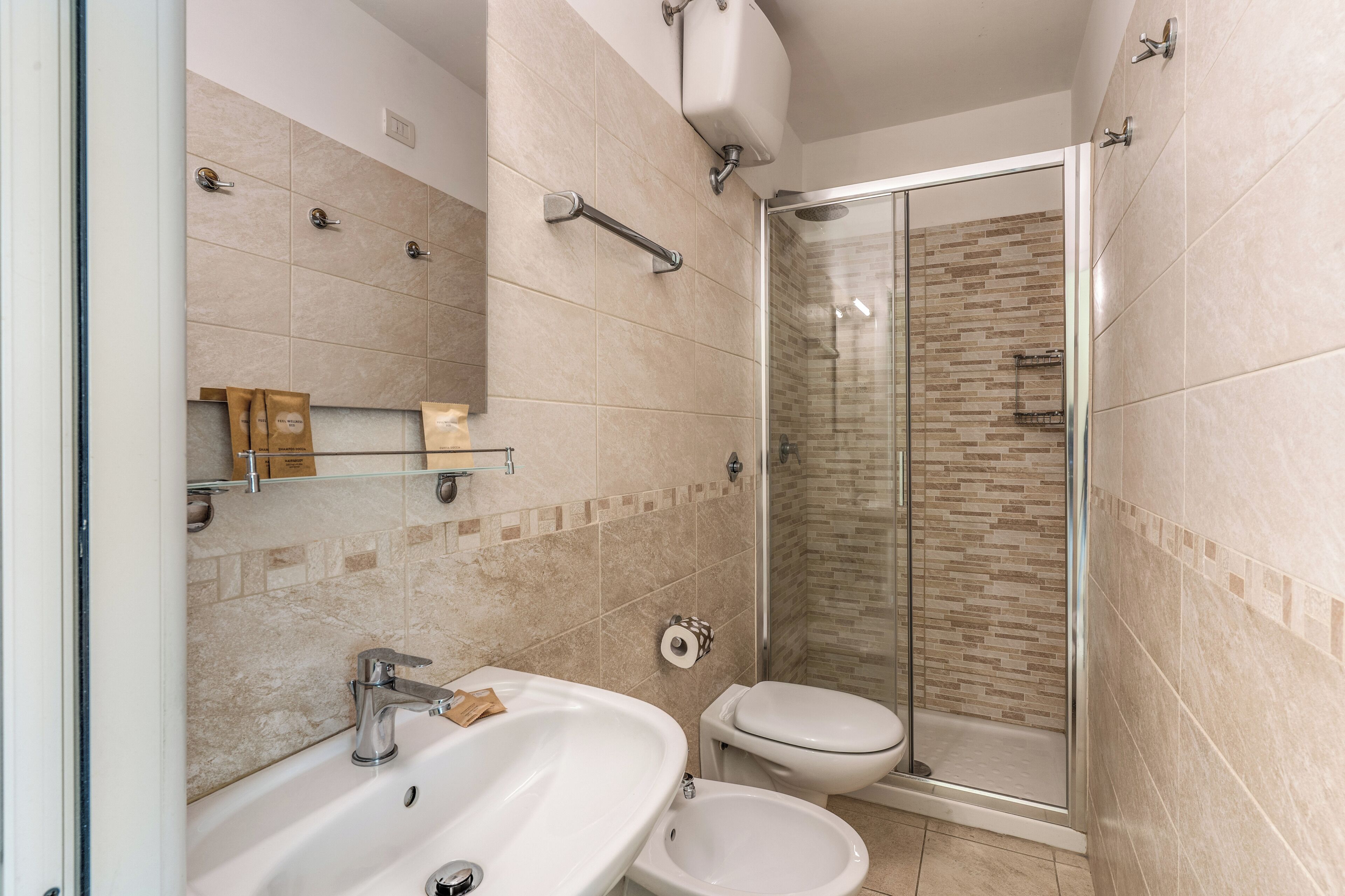 shower, hair dryer, bidet, towels