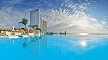 Indoor pool, seasonal outdoor pool, open 8 AM to 4:00 PM, pool umbrellas