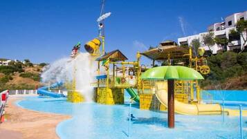 Enjoy thrilling water slides, a wave machine, and a splash pad in this vibrant water park.