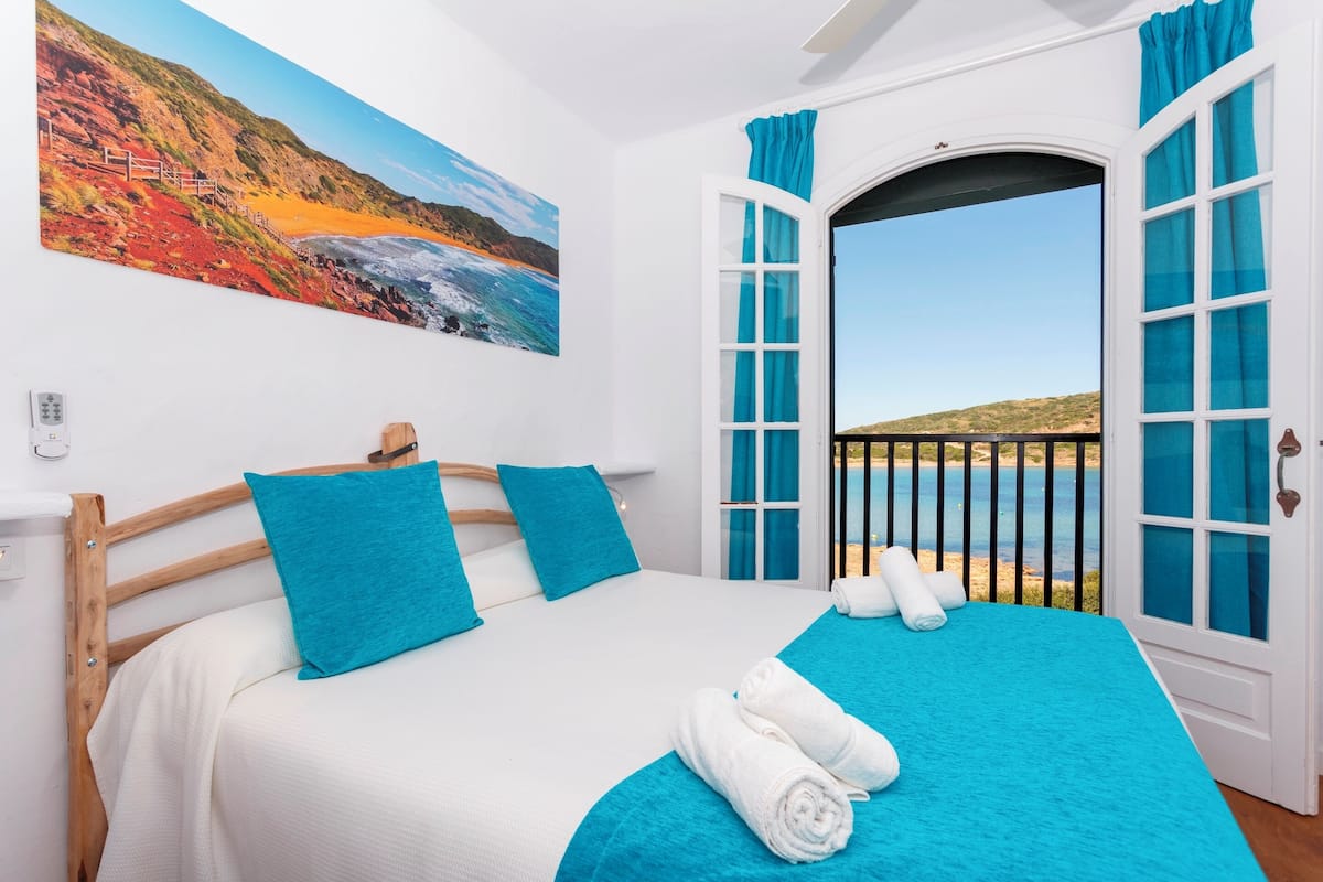 Apartment, 2 Bedrooms, Partial Sea View | Blackout drapes, free cribs/infant beds, free WiFi, bed sheets