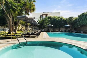 Seasonal outdoor pool, pool loungers