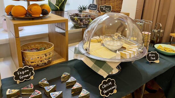 A buffet with vegan spread, cheese variations, and meat pâté. - Dan In'n Out (Vienna)