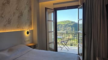 Double Room, Balcony, Mountain View | Blackout drapes, iron/ironing board, free WiFi, bed sheets