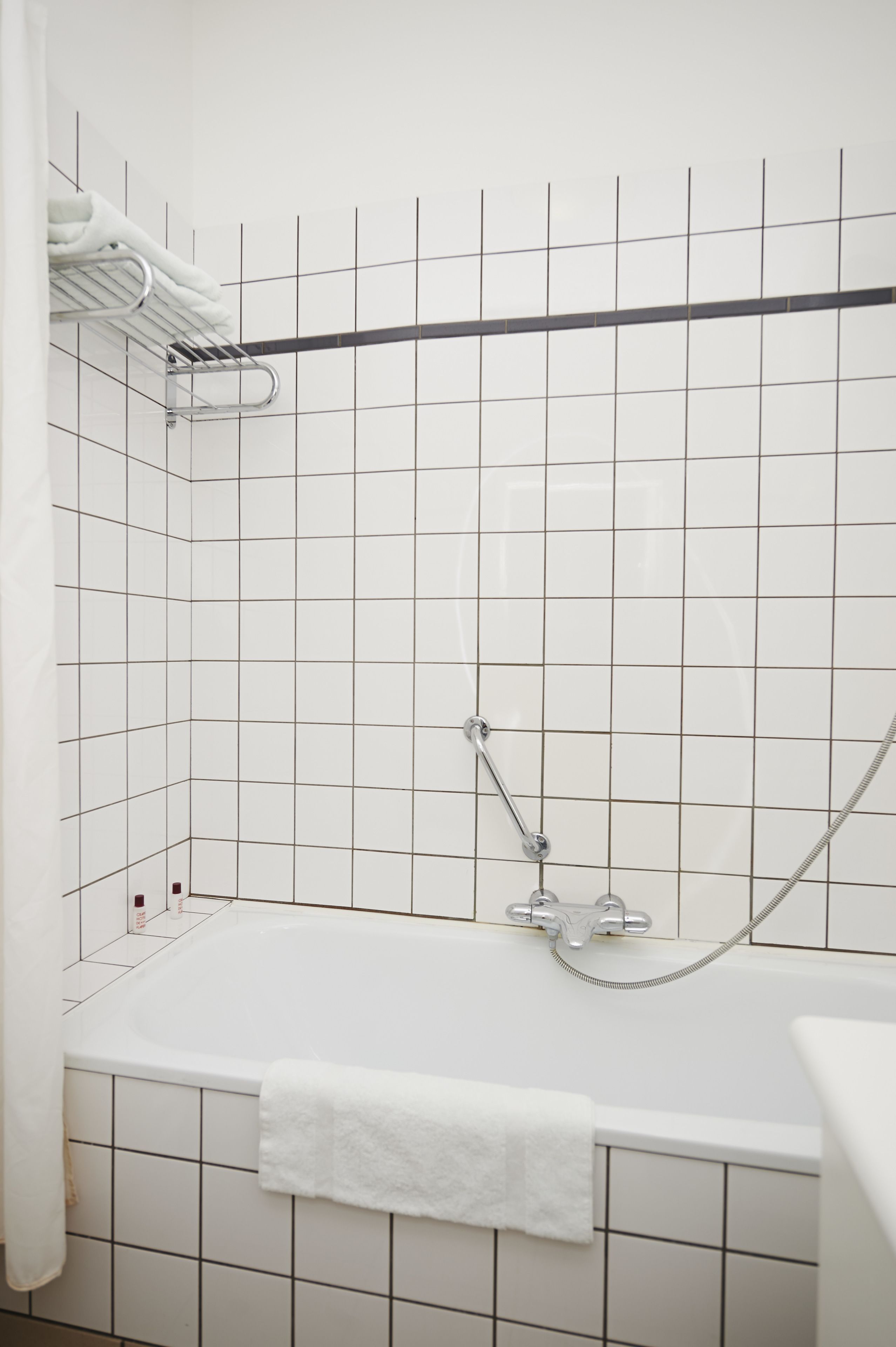 Bathtub, hair dryer, towels