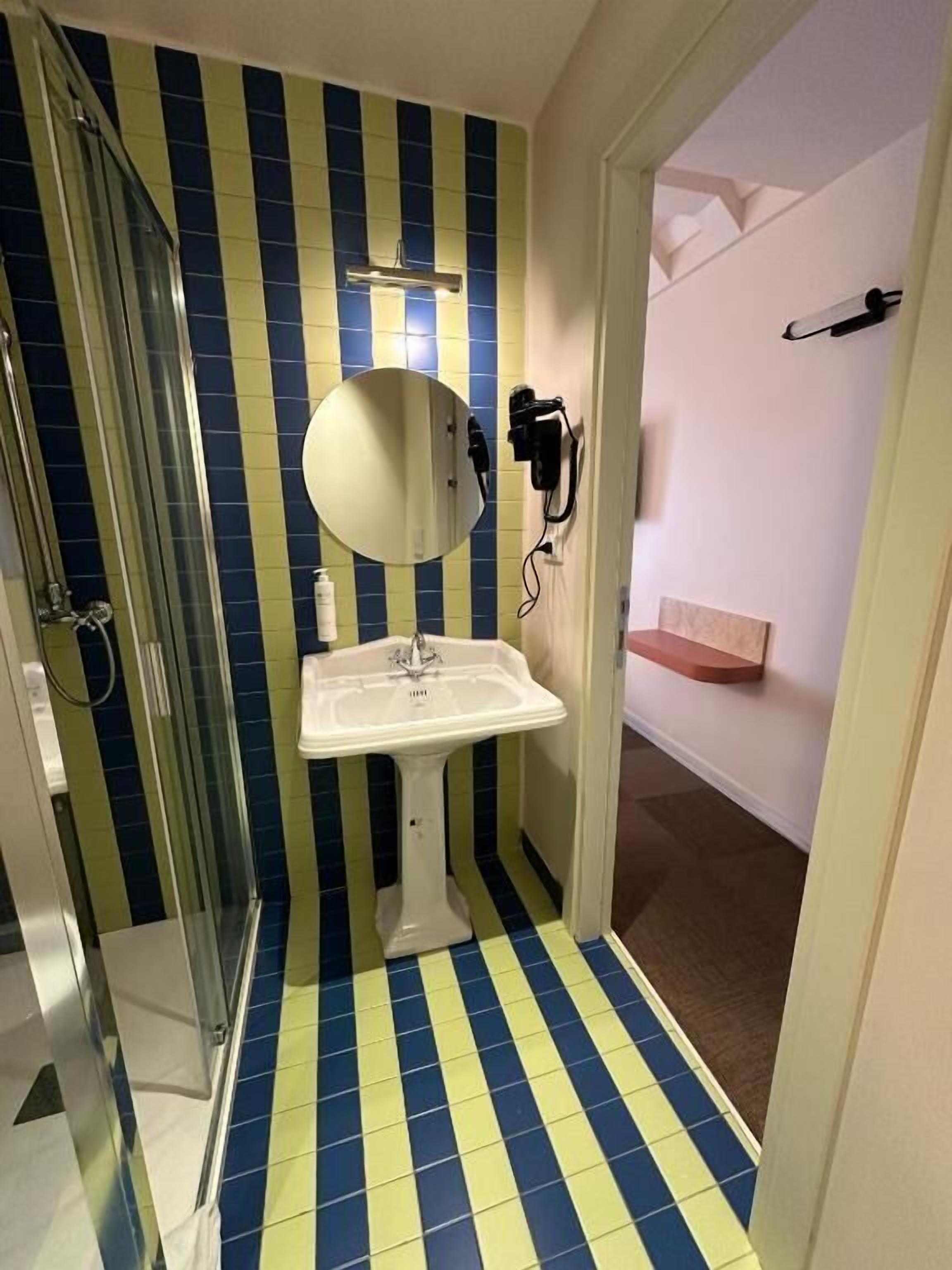 superior double or twin room | bathroom | bathtub, free toiletries, hair dryer, towels