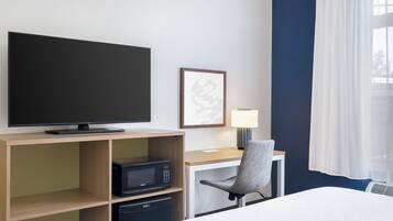 Desk, laptop workspace, blackout curtains, iron/ironing board