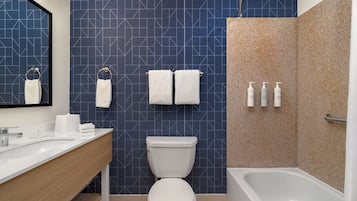 Room, 1 King Bed | Bathroom | Combined shower/tub, free toiletries, hair dryer, towels
