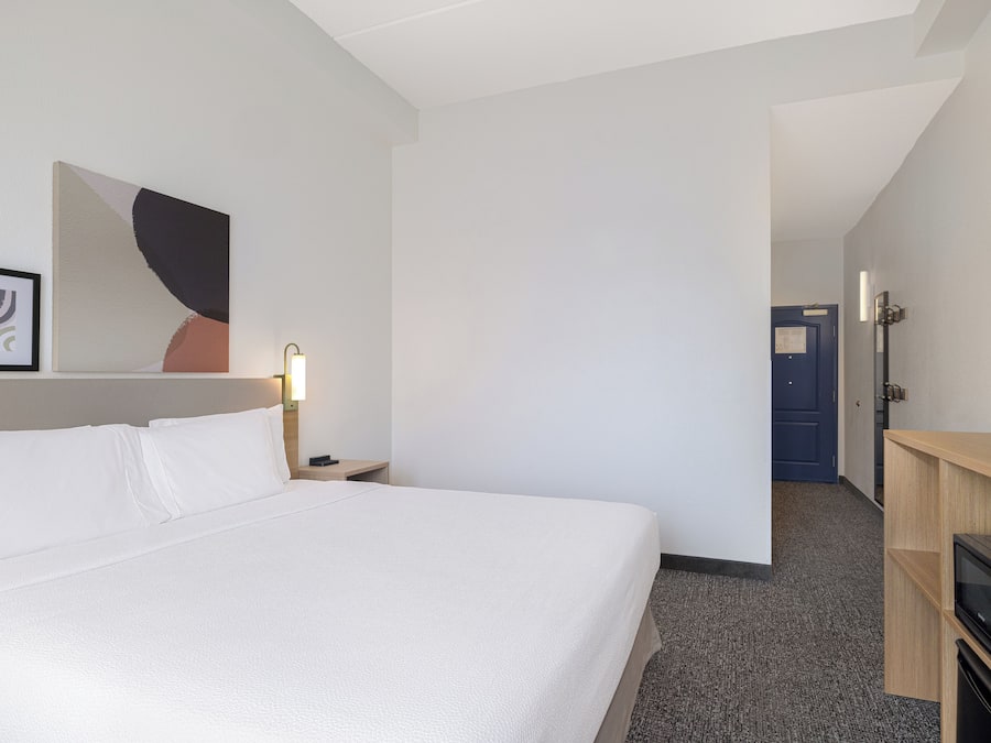 Room, 1 King Bed, Accessible (Mobility & Hearing, Roll-in Shower) | Desk, laptop workspace, blackout drapes, iron/ironing board