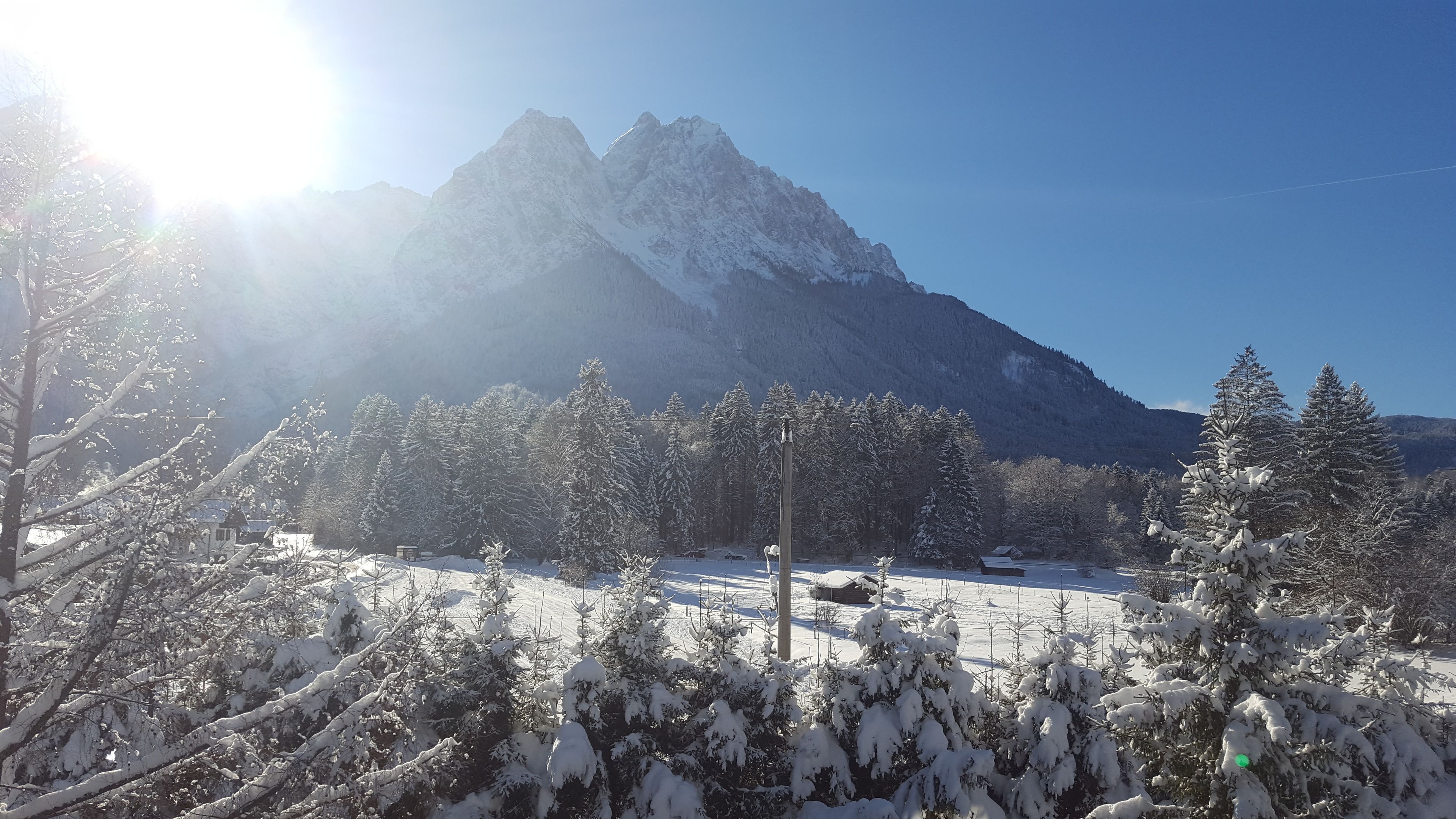 A snowy mountain landscape with a clear sky.