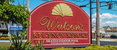 A sign for Watson's Regency Resort with a heated indoor pool.