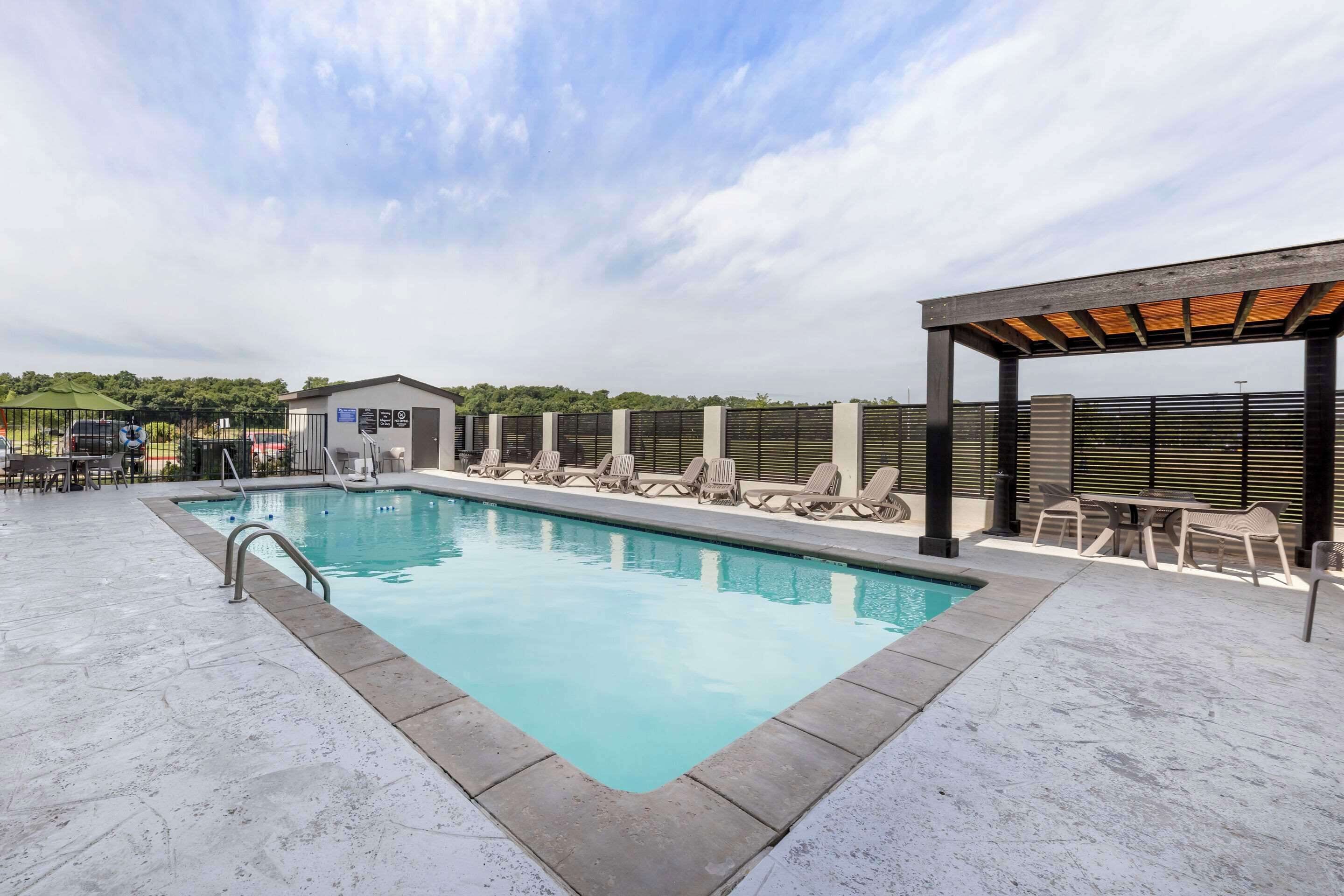 seasonal outdoor pool, open 9:30 am to 9:30 pm, pool umbrellas