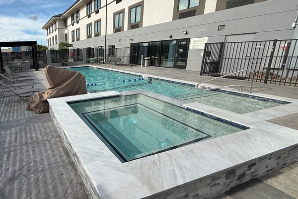 Seasonal outdoor pool, open 9:30 AM to 10:00 PM, pool umbrellas