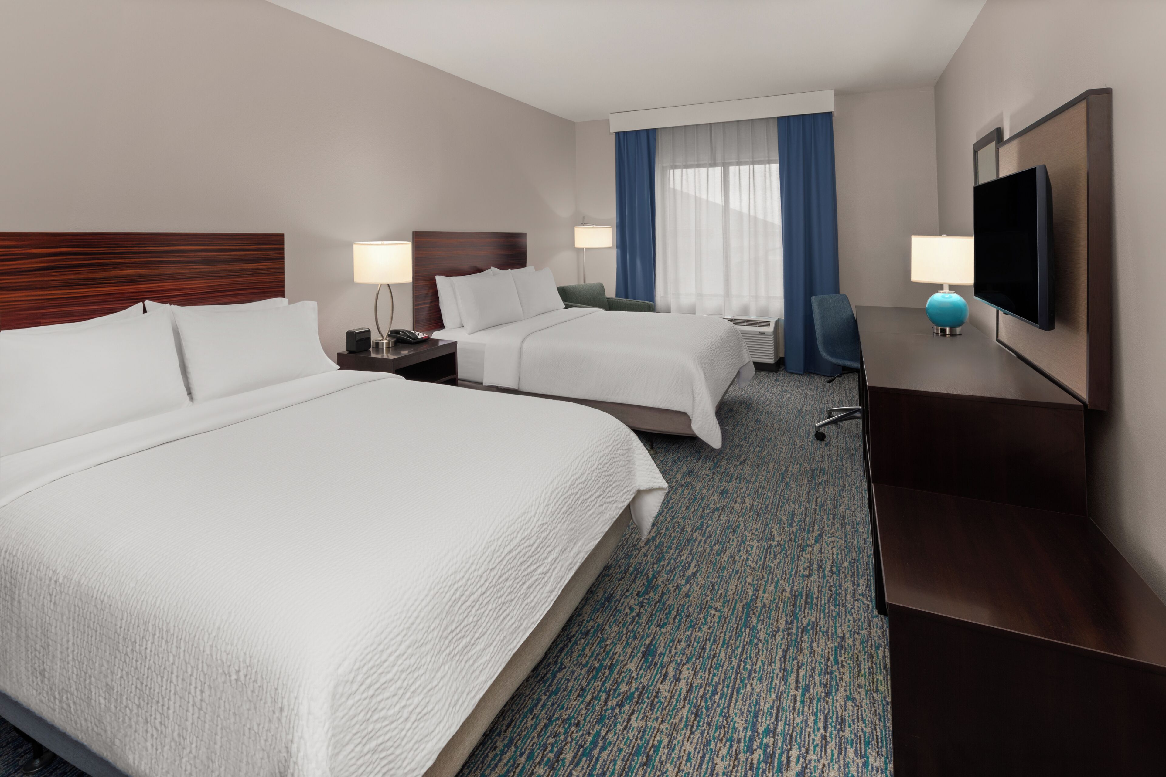 Premium bedding, pillowtop beds, desk, laptop workspace