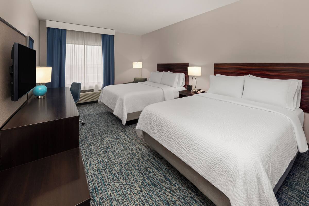 Premium bedding, pillowtop beds, desk, laptop workspace