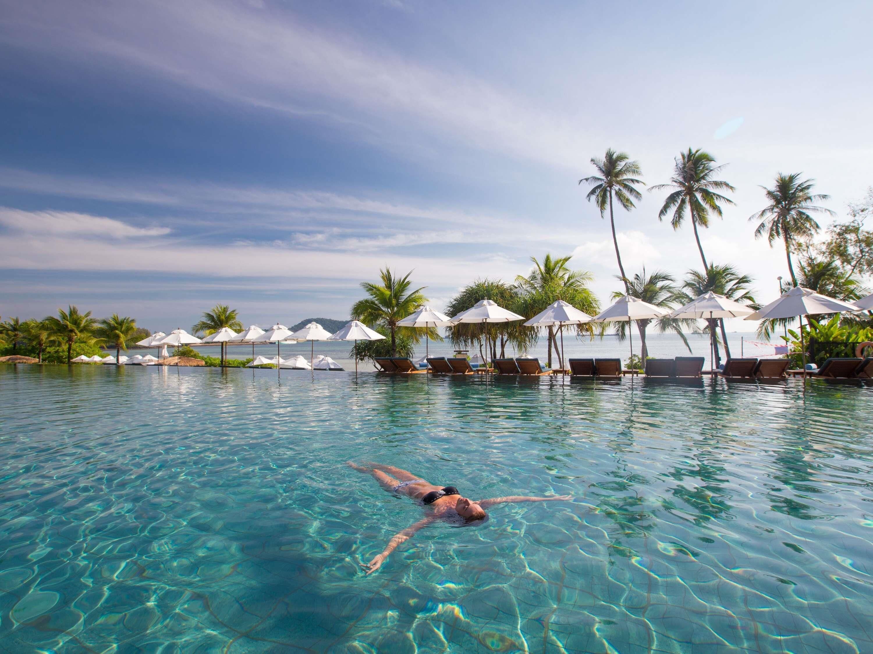 2 outdoor pools, open 7 AM to 7 PM, free cabanas, pool umbrellas