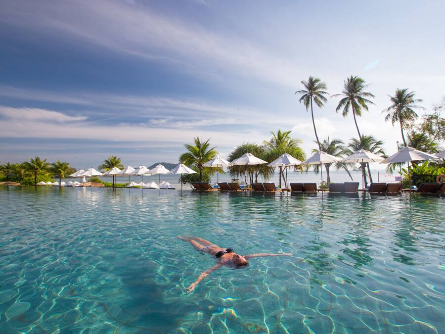 2 outdoor pools, open 7 AM to 7 PM, free cabanas, pool umbrellas