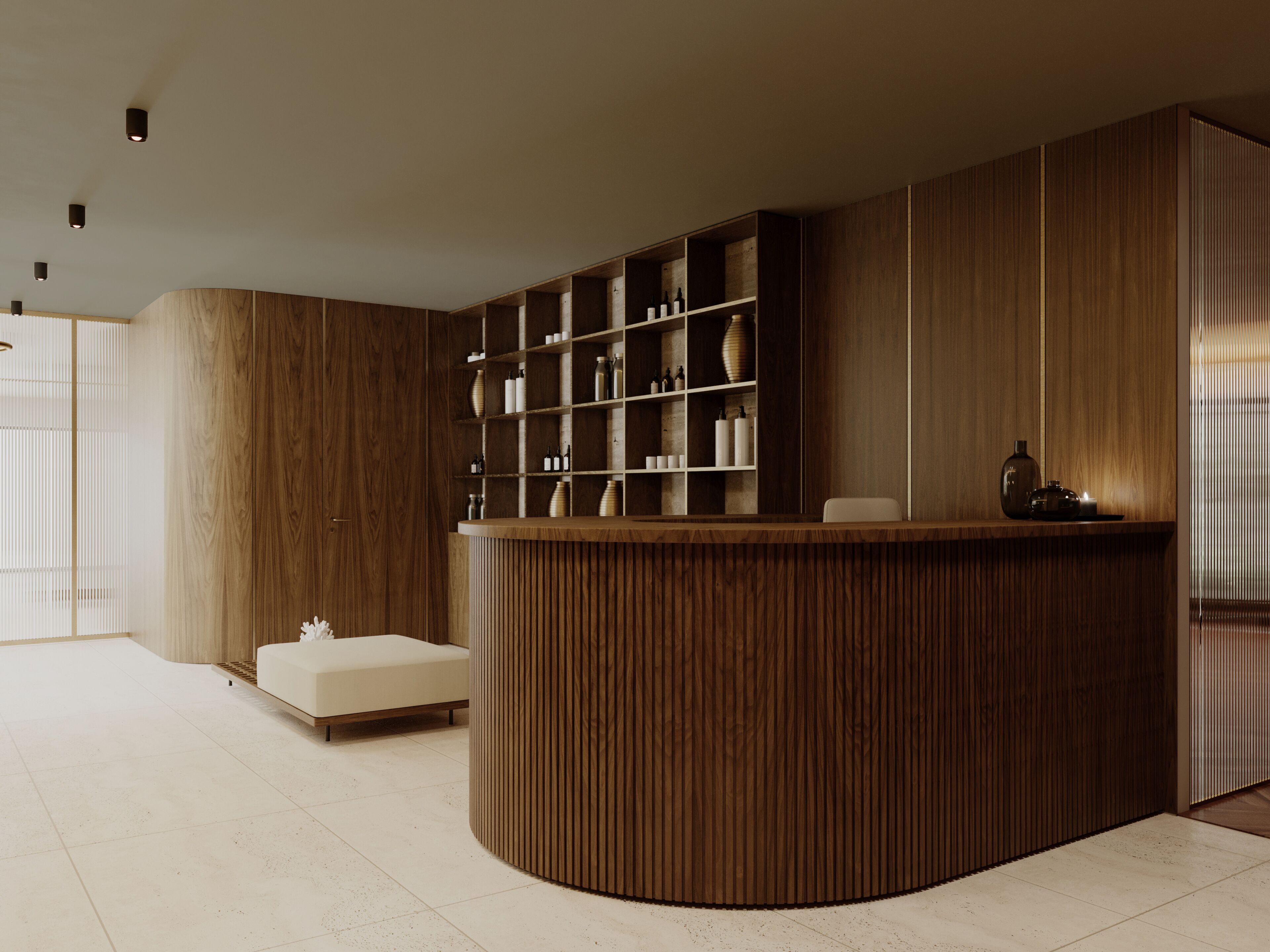 A modern reception desk with a wooden finish, a seating area with a white sofa, and a shelving unit with various items.