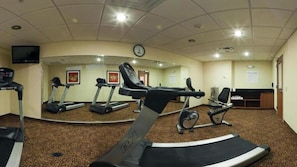A gym with treadmills, stationary bikes, and a mirrored wall. - Holiday Inn Express Hotel & Suites Bainbridge by IHG (Bainbridge)