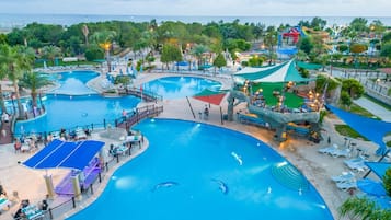 2 indoor pools, 5 outdoor pools, open 7:30 AM to 7 PM, pool umbrellas