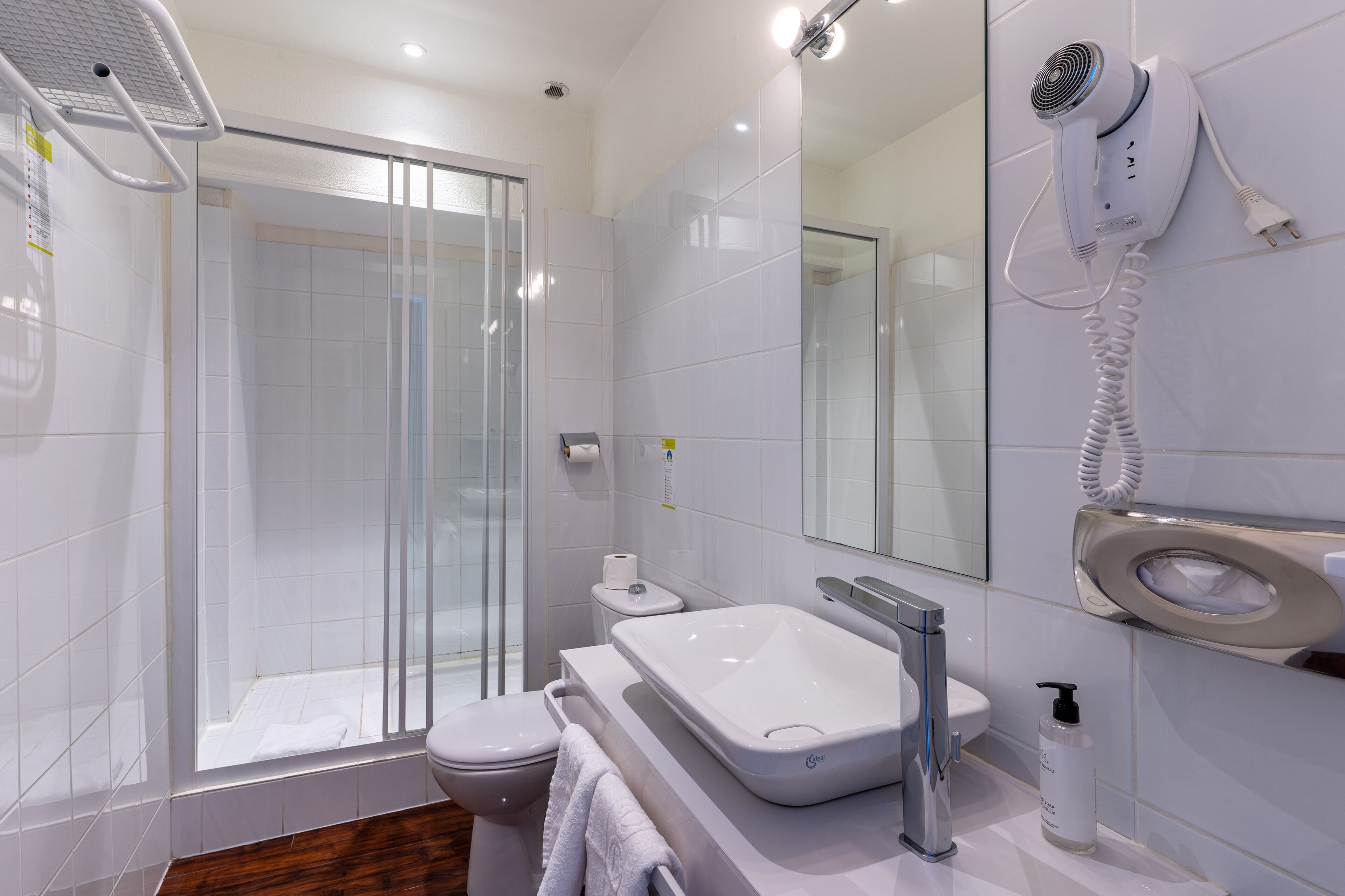 eco-friendly toiletries, hair dryer, towels