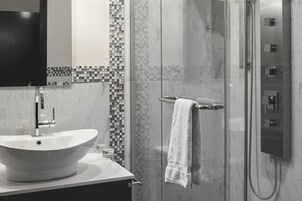 Shower, hydromassage showerhead, designer toiletries, hair dryer