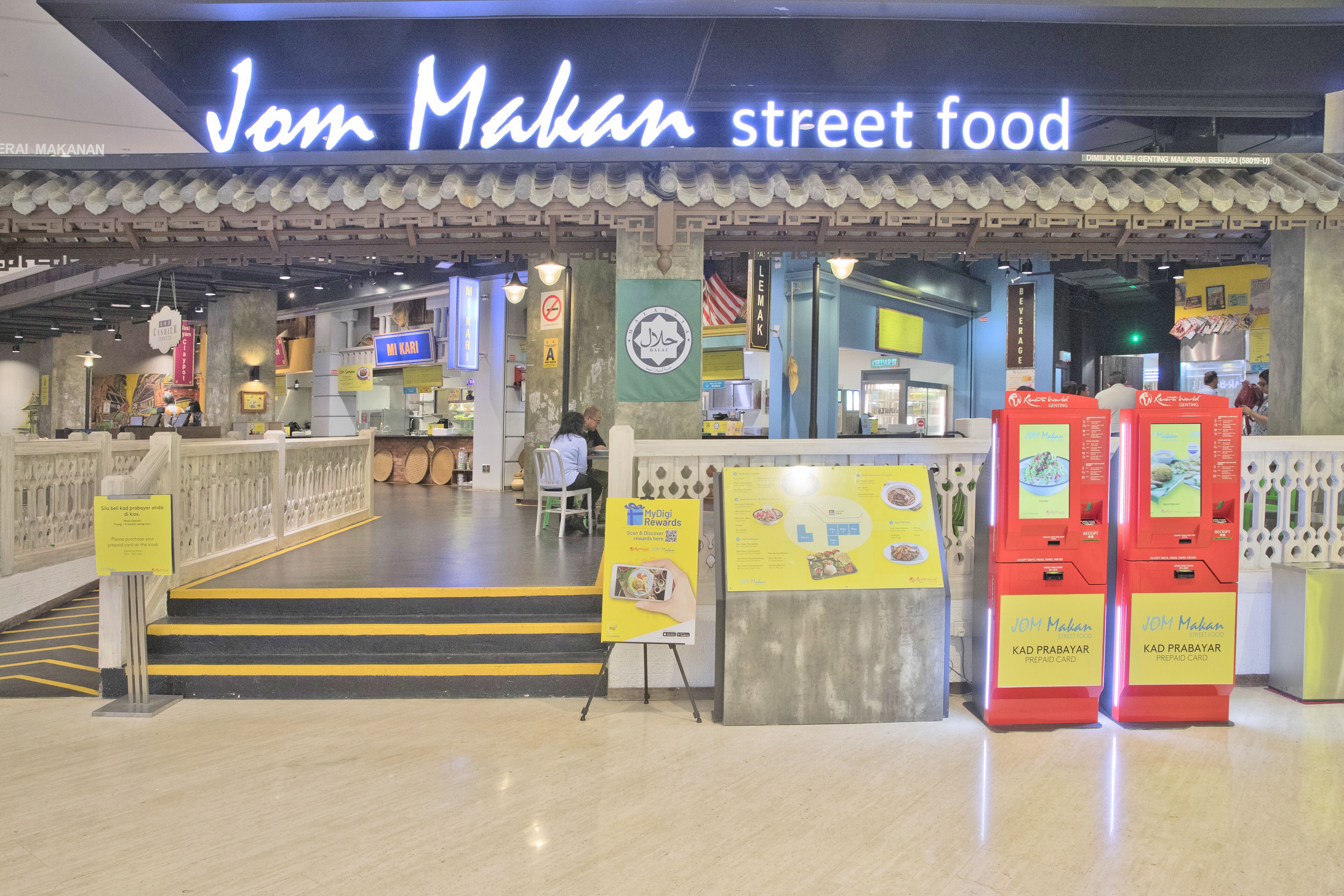 A food court with a sign for 'Jan Makan street food' and a MyDine Rewards sign.