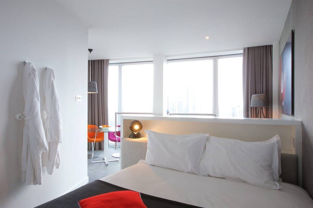 Studio | Premium bedding, desk, laptop workspace, blackout curtains