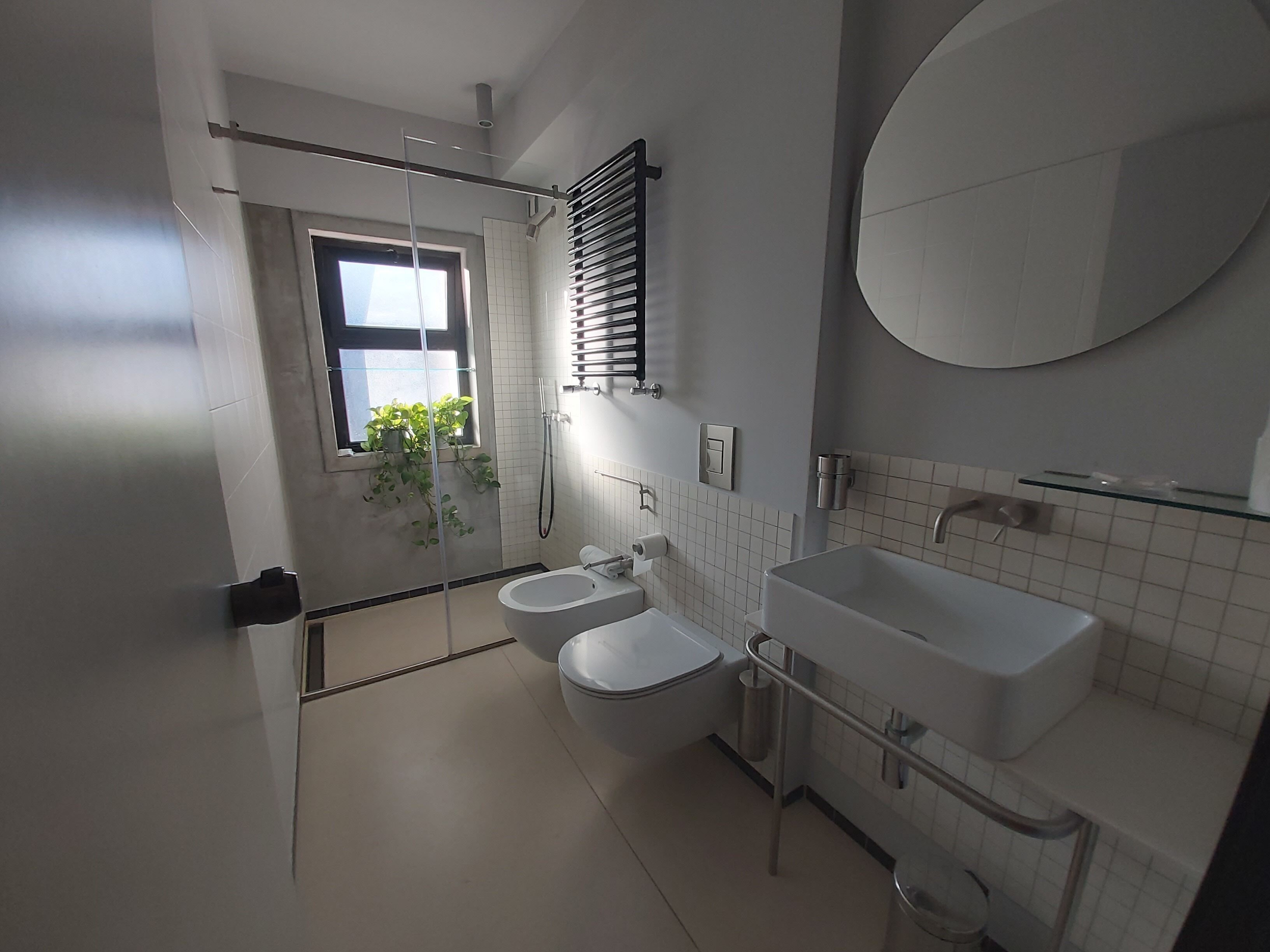 hair dryer, bathrobes, bidet, towels