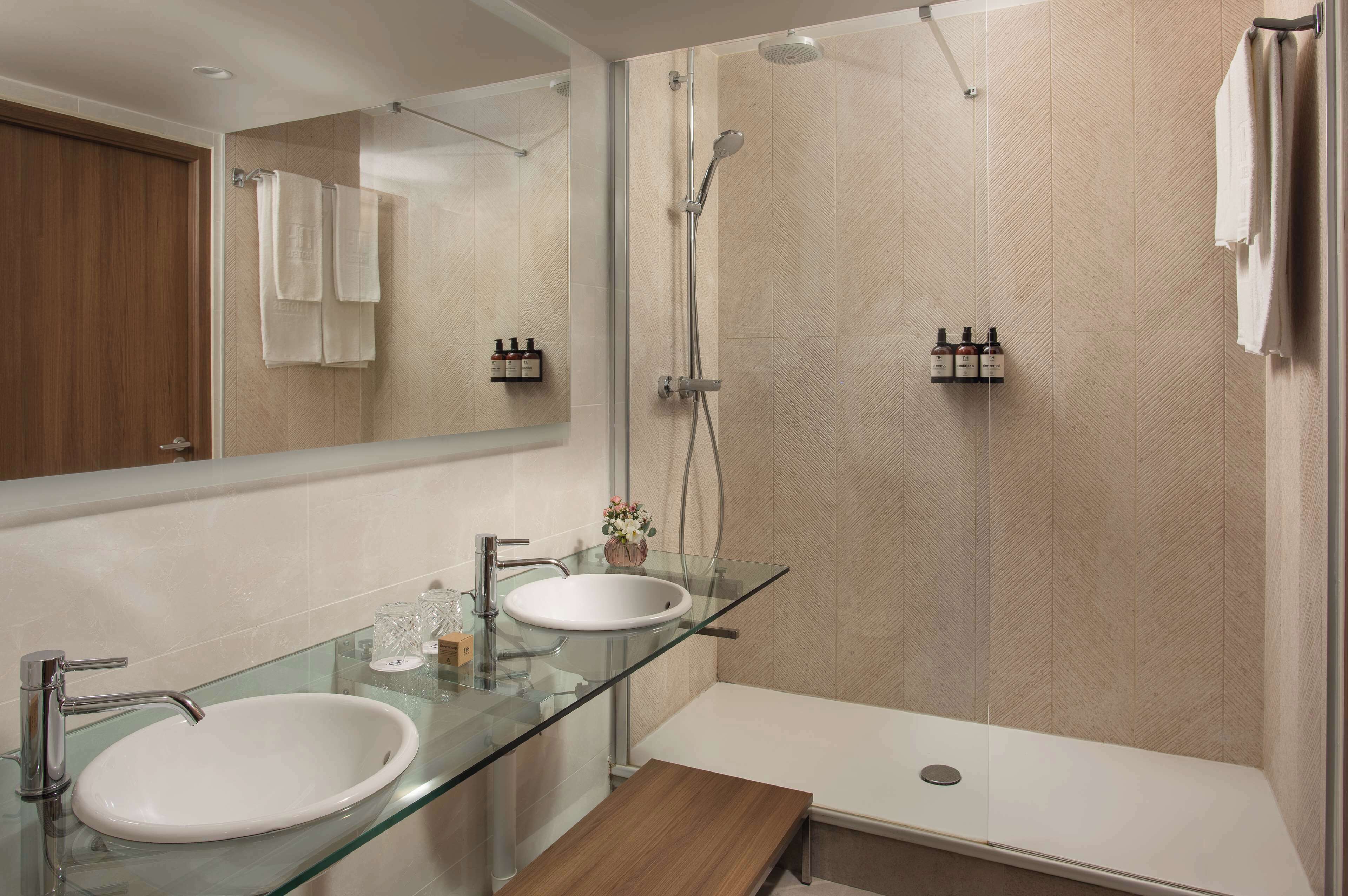 bathtub, eco-friendly toiletries, hair dryer, towels