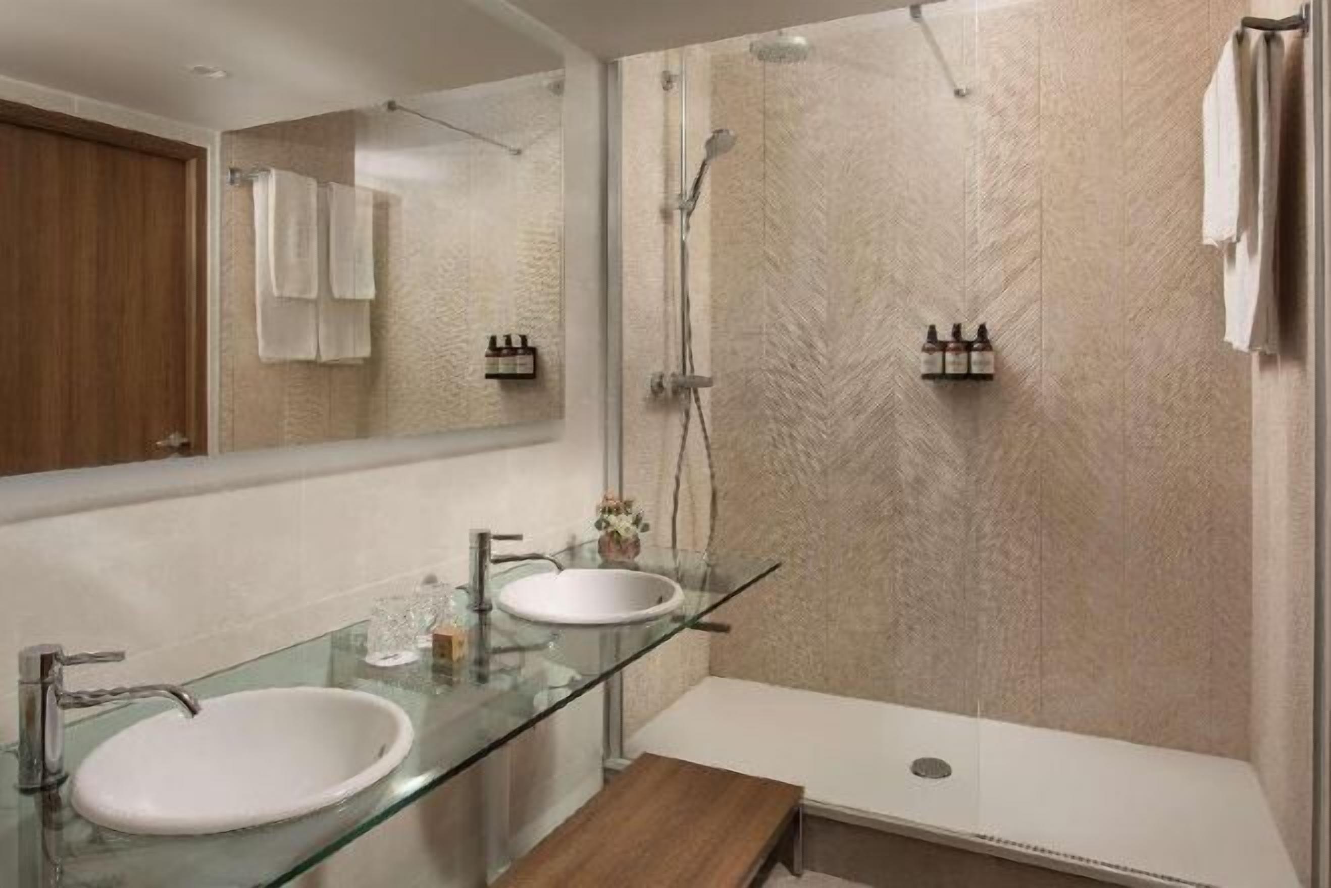 Bathtub, eco-friendly toiletries, hair dryer, towels