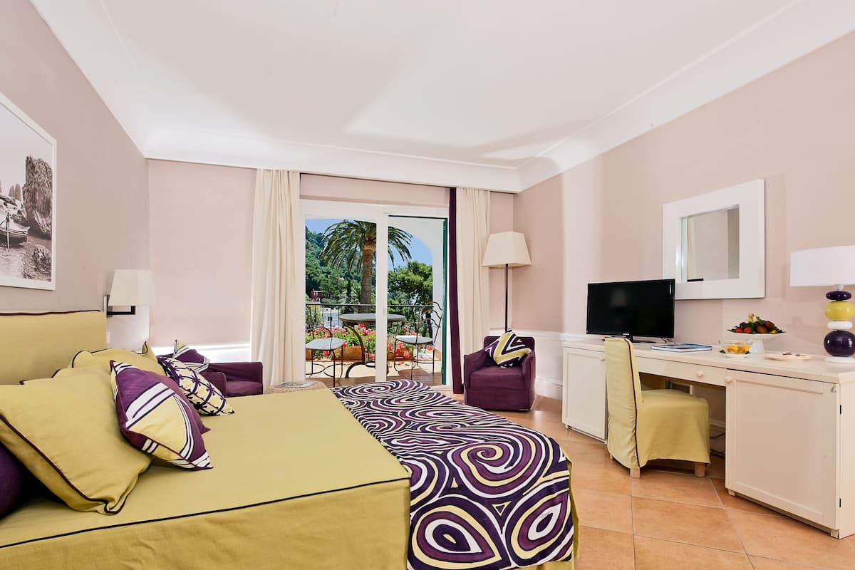 Junior Suite, Patio, Sea View | Minibar, in-room safe, desk, free WiFi