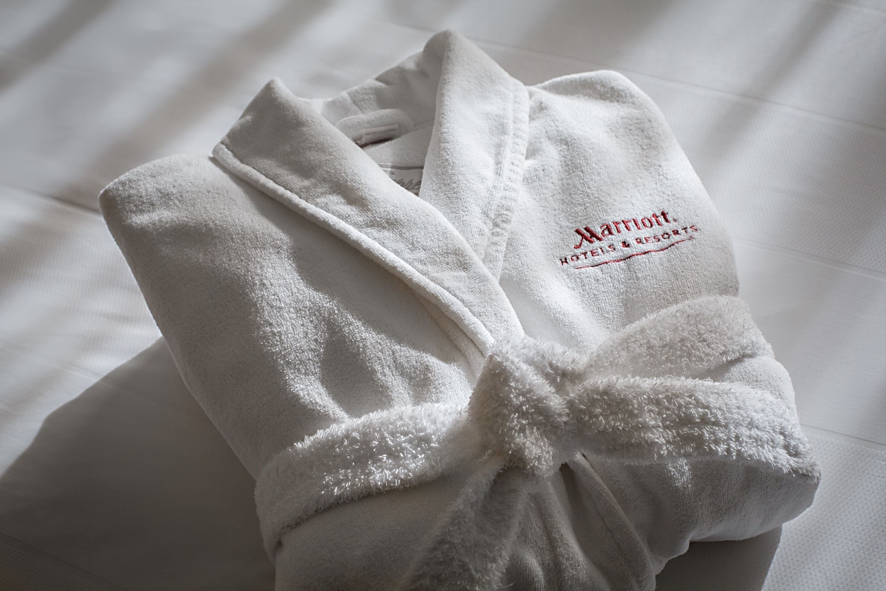 combined shower/bathtub, designer toiletries, hair dryer, bathrobes