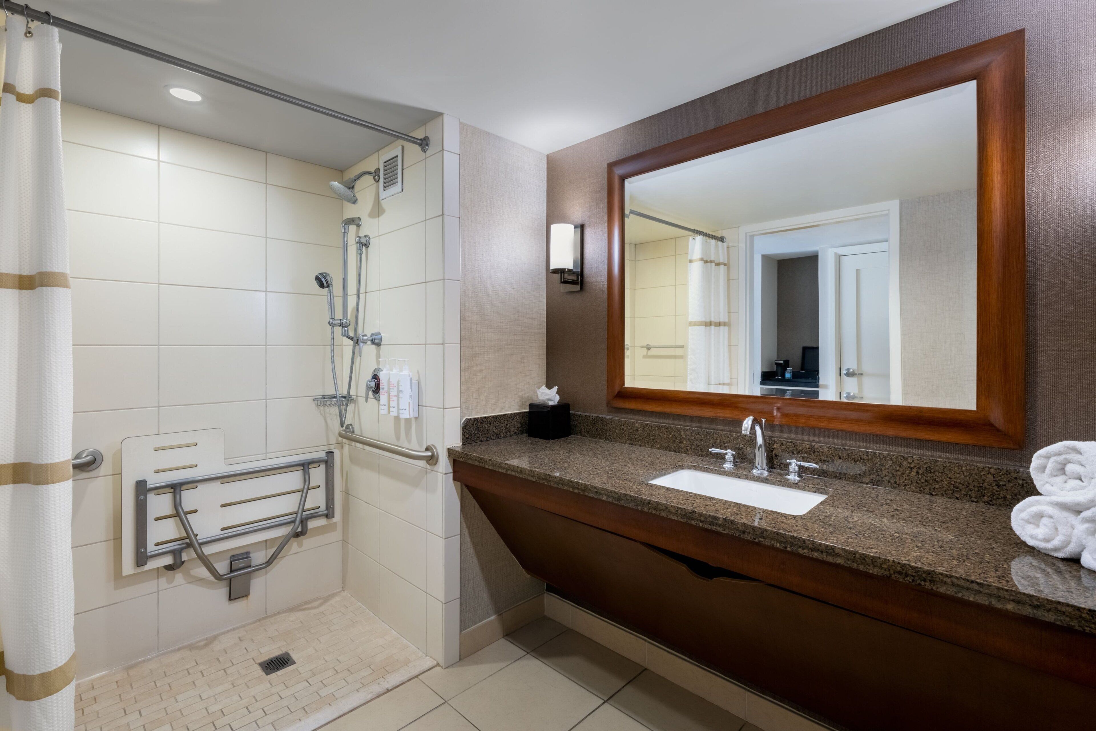 combined shower/bathtub, designer toiletries, hair dryer, bathrobes