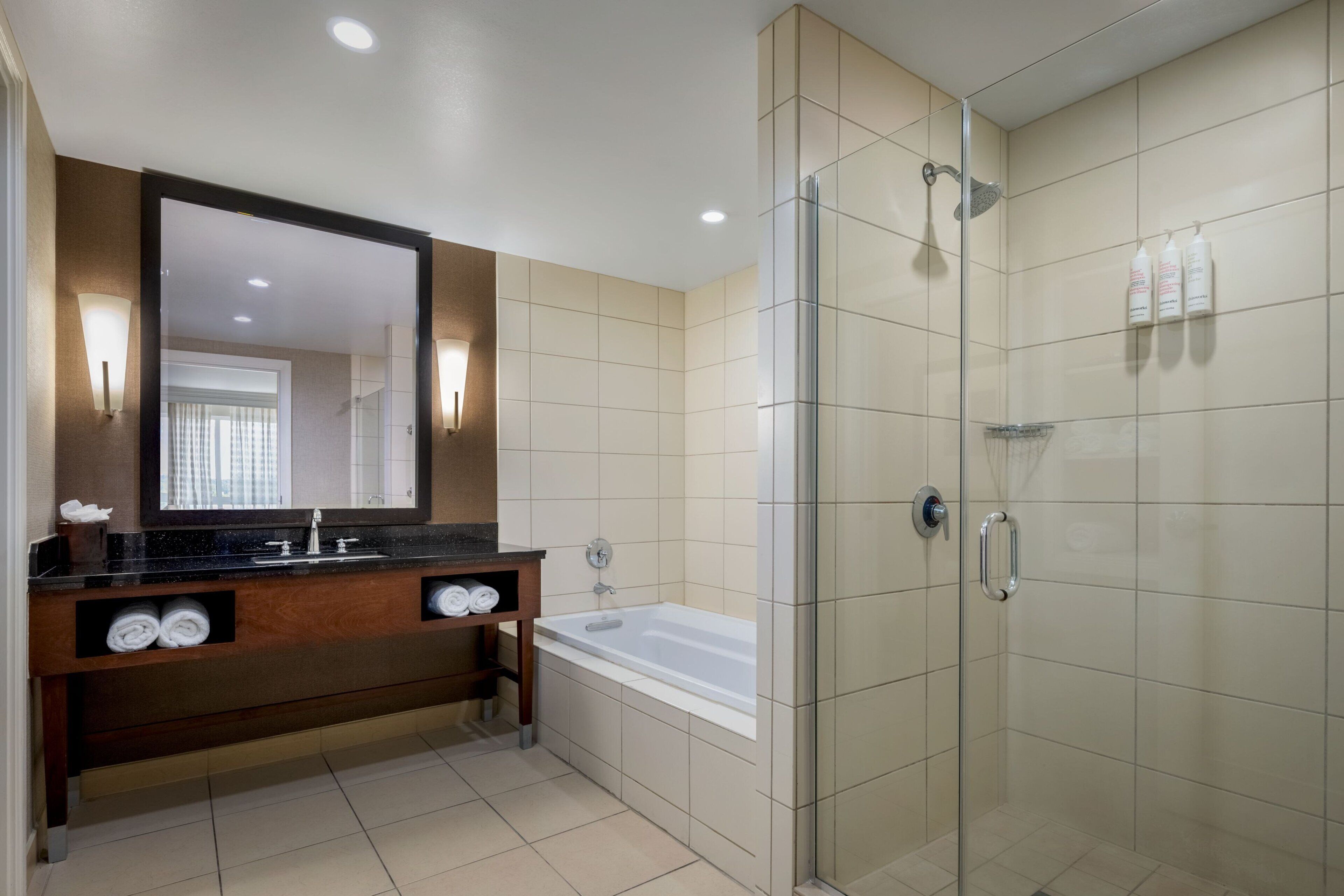 combined shower/bathtub, designer toiletries, hair dryer, bathrobes