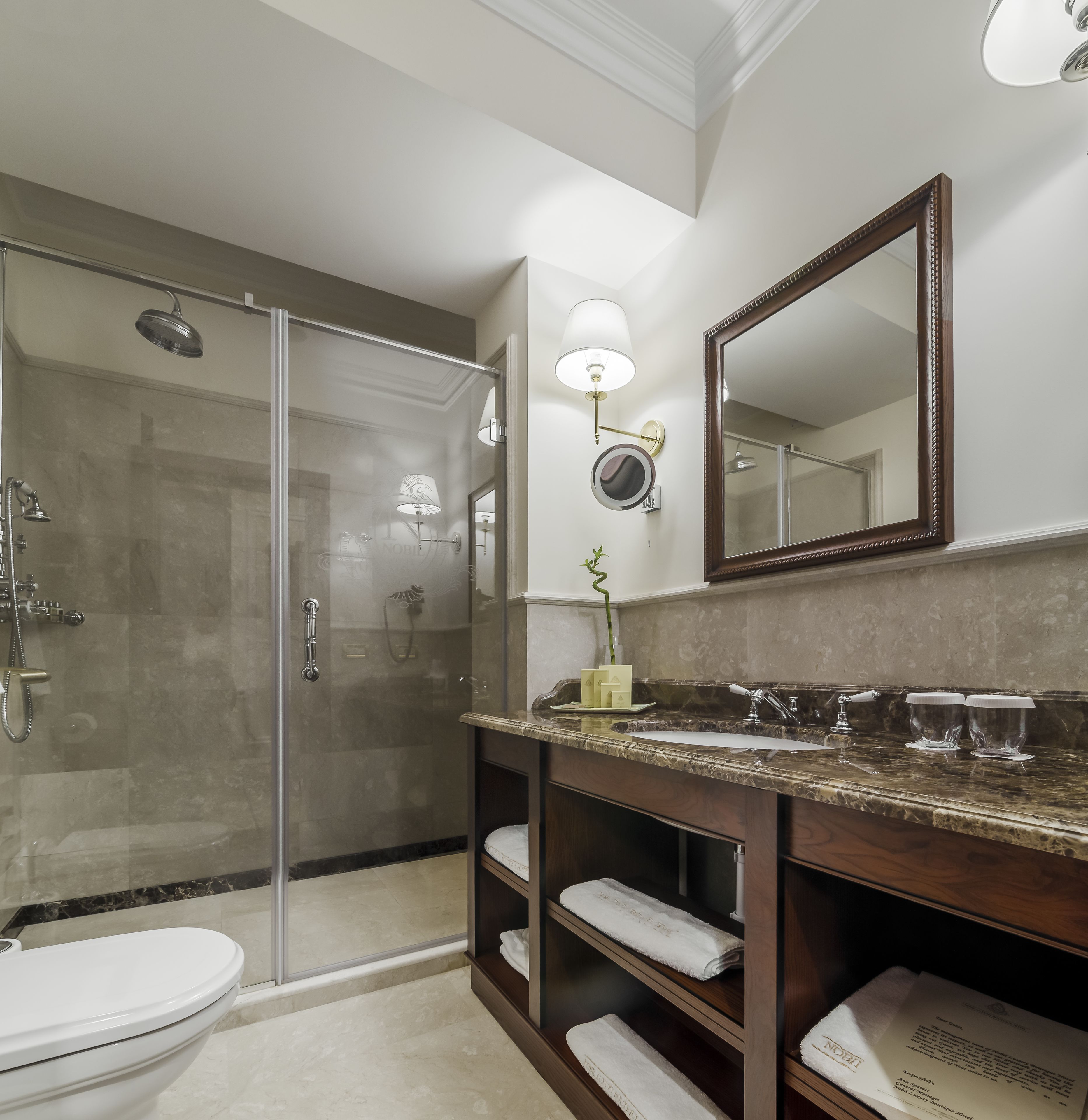 standard double room | bathroom | rainfall showerhead, designer toiletries, hair dryer, bathrobes