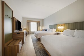 A hotel room with two beds, a TV, a desk, and a window with curtains. - Hampton Inn Hickory (Hickory)