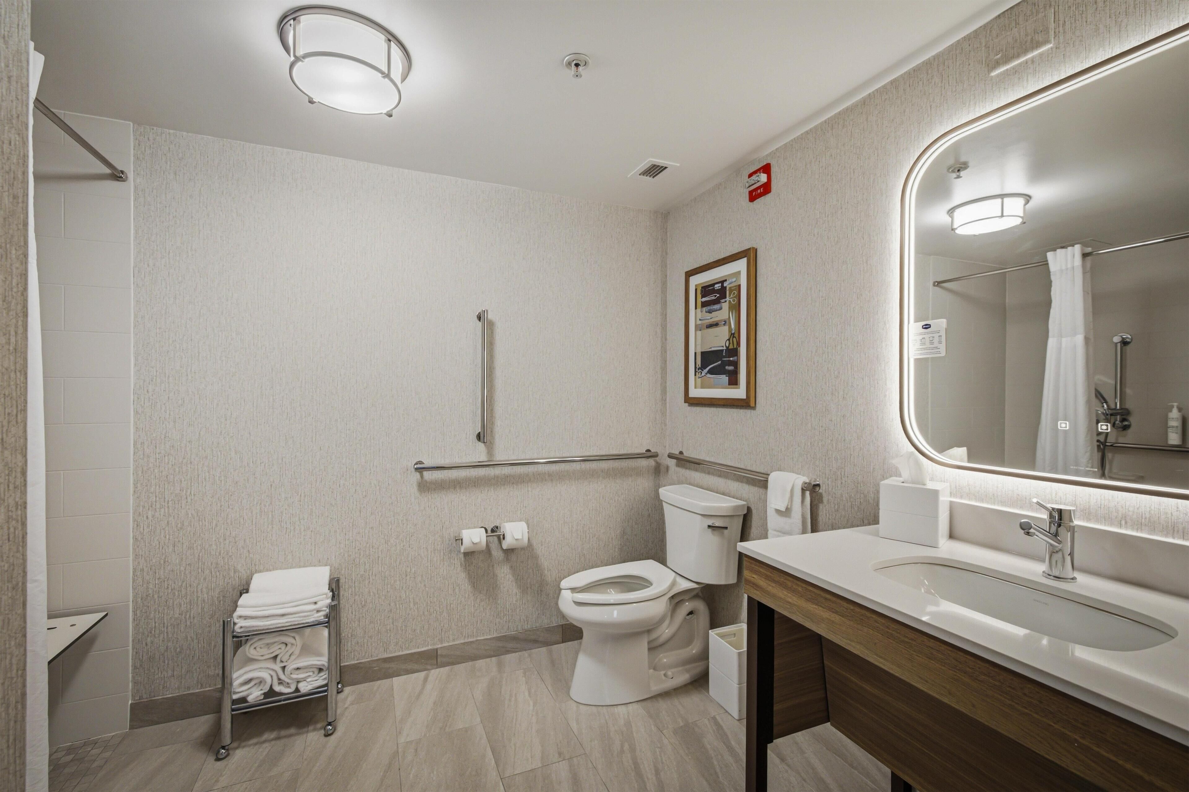 Studio, 1 King Bed, Accessible, Non Smoking (Mobility & Hearing, Roll-in Shower) | Bathroom | Free toiletries, hair dryer, towels