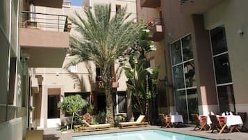 Outdoor pool, pool umbrellas, sun loungers